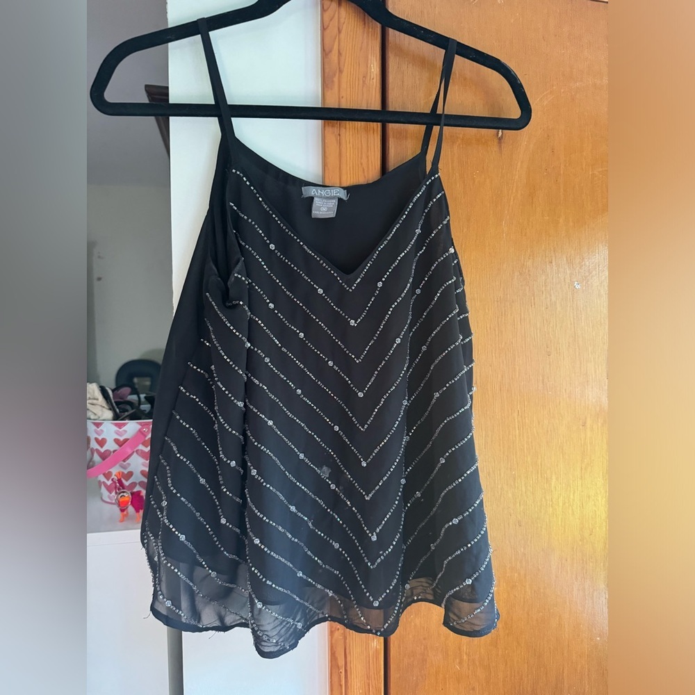 Black Sleeveless Top with Silver Accents